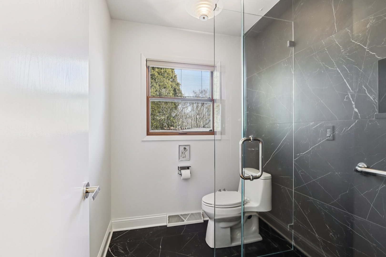 2019 East Avon Lane Arlington Heights, IL 60004 - Photo 21 of 58 a bathroom with a toilet and a shower