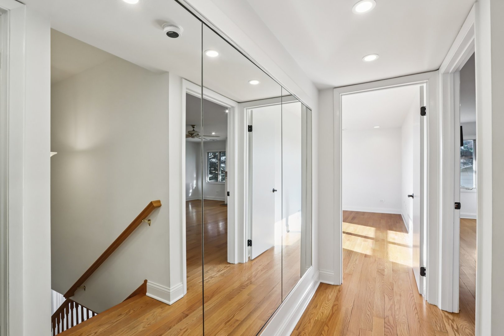 2019 East Avon Lane Arlington Heights, IL 60004 - Photo 29 of 58 a view of a hallway with wooden floor and staircase