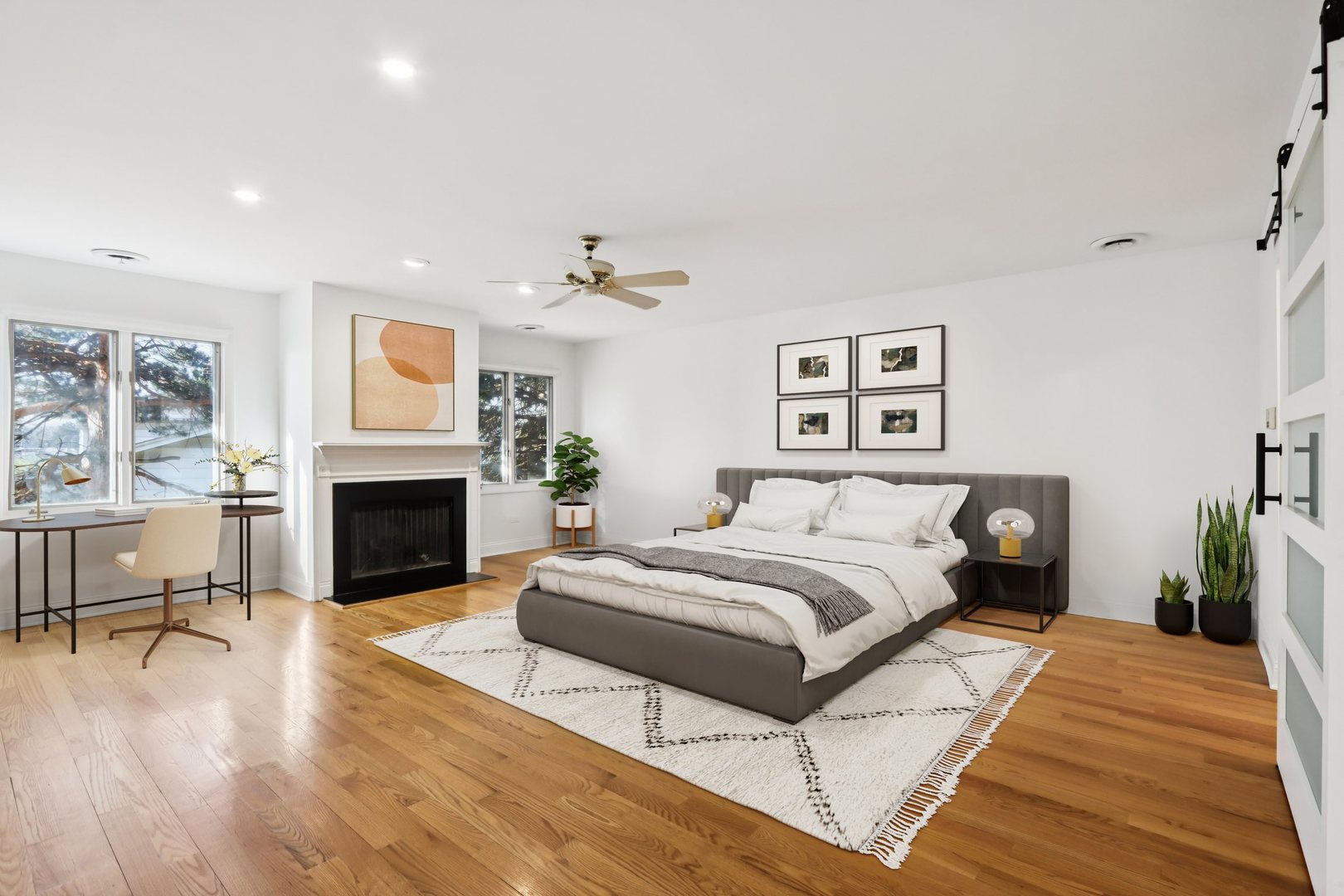 2019 East Avon Lane Arlington Heights, IL 60004 - Photo 30 of 58 a spacious bedroom with a bed and a fireplace