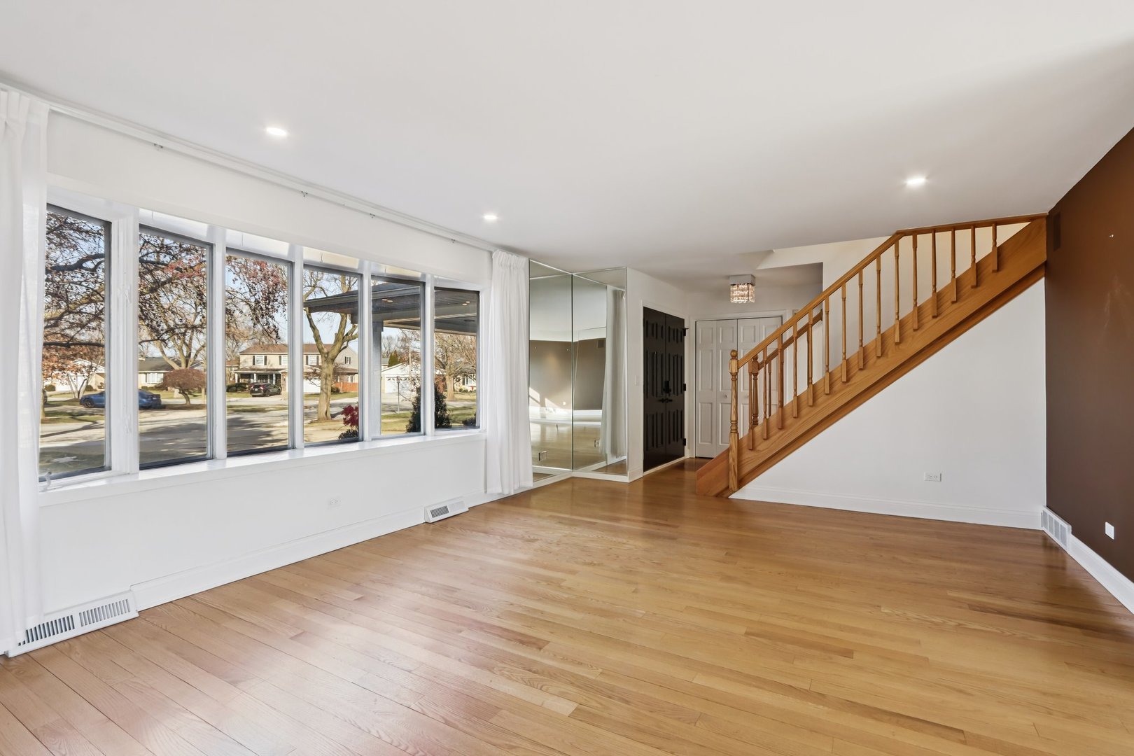 2019 East Avon Lane Arlington Heights, IL 60004 - Photo 5 of 58 a view of an empty room with wooden floor and a window