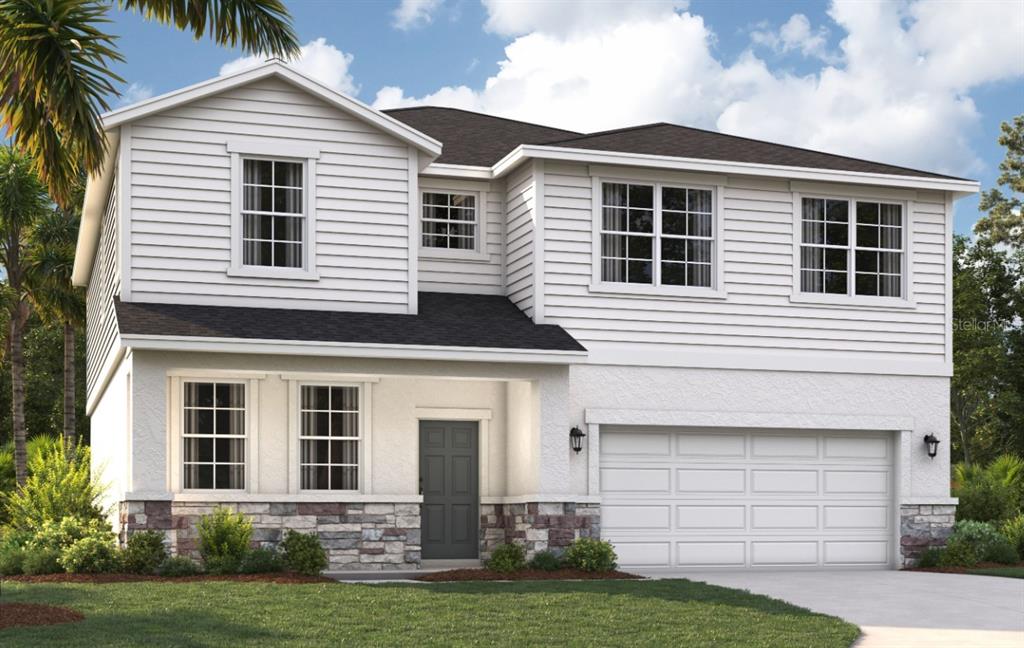 a front view of a house with a yard and garage