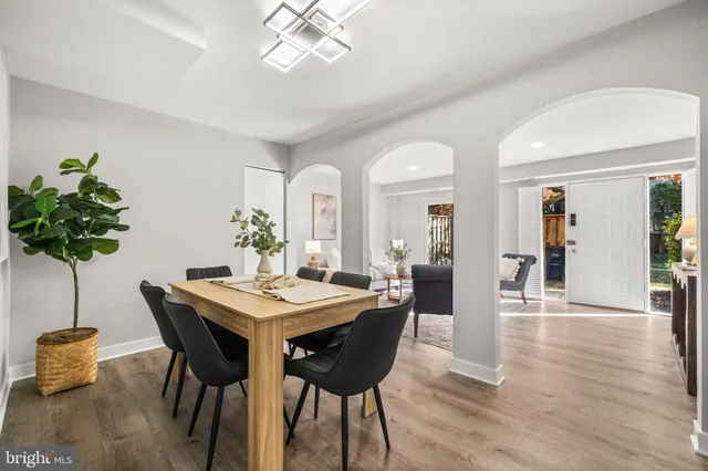 a view of a dining room with furniture and wooden floor