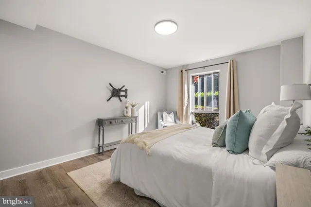 a bedroom with a bed and a table