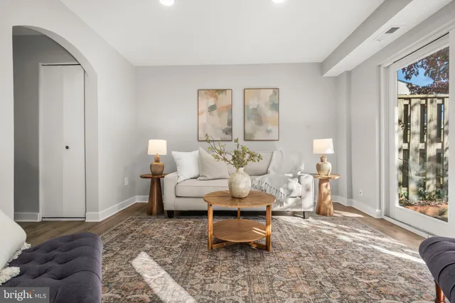 a living room with furniture and a window
