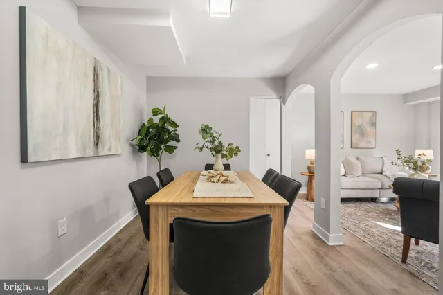 a view of a dining room with a table and chairs