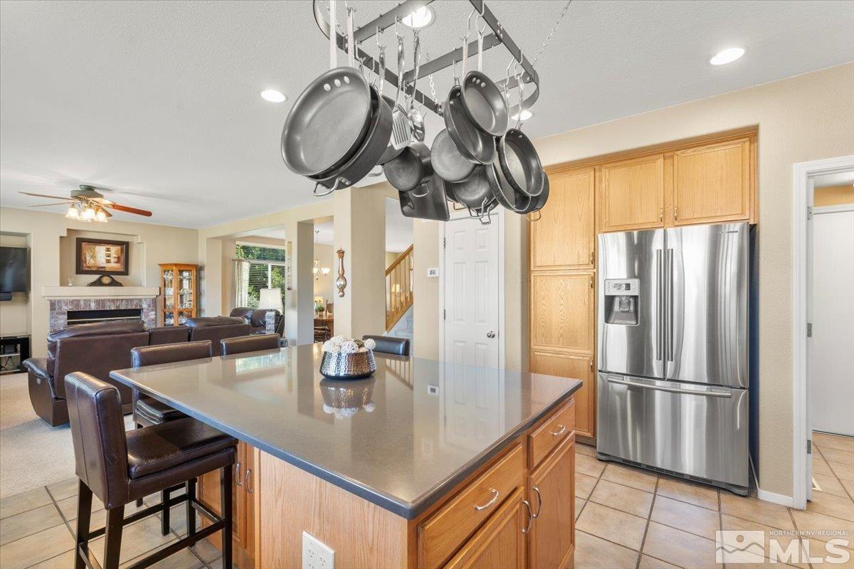 2225 Solitude Drive Reno, NV 89511 - Photo 11 of 40 a kitchen with stainless steel appliances granite countertop a sink a stove and refrigerator
