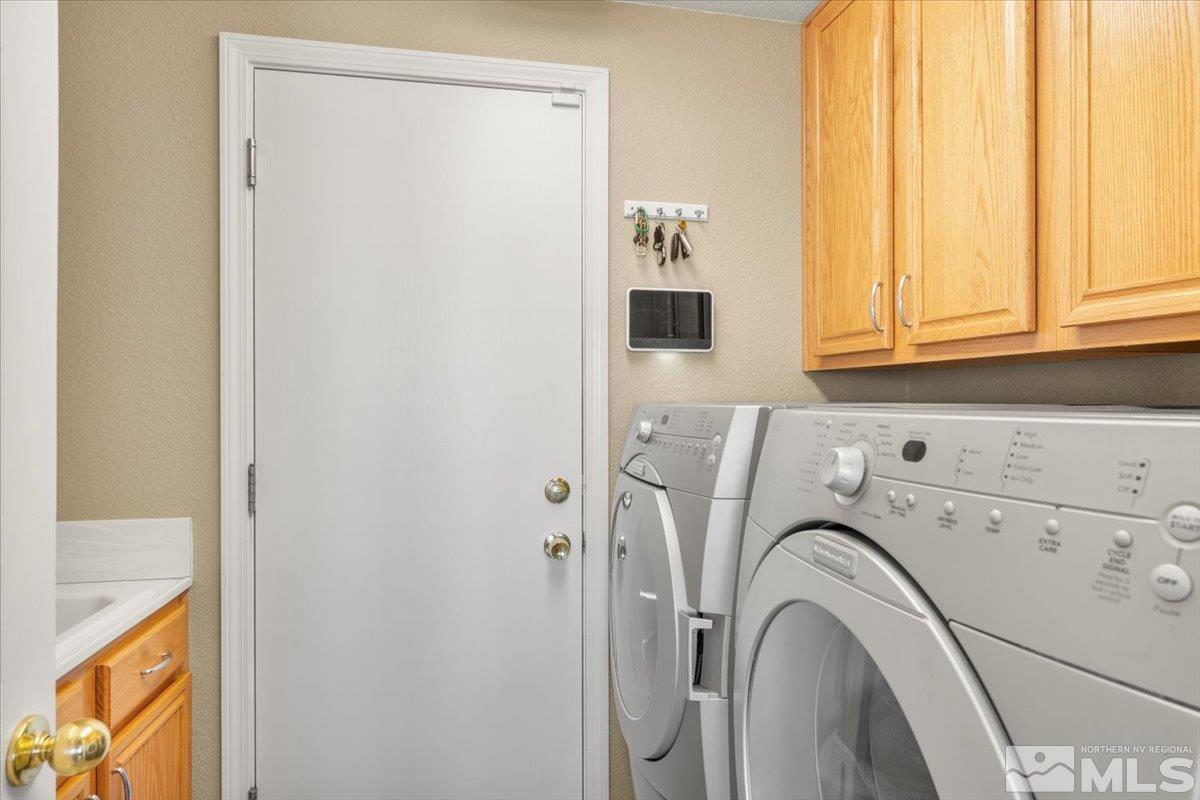 2225 Solitude Drive Reno, NV 89511 - Photo 14 of 40 a utility room with dryer and washer