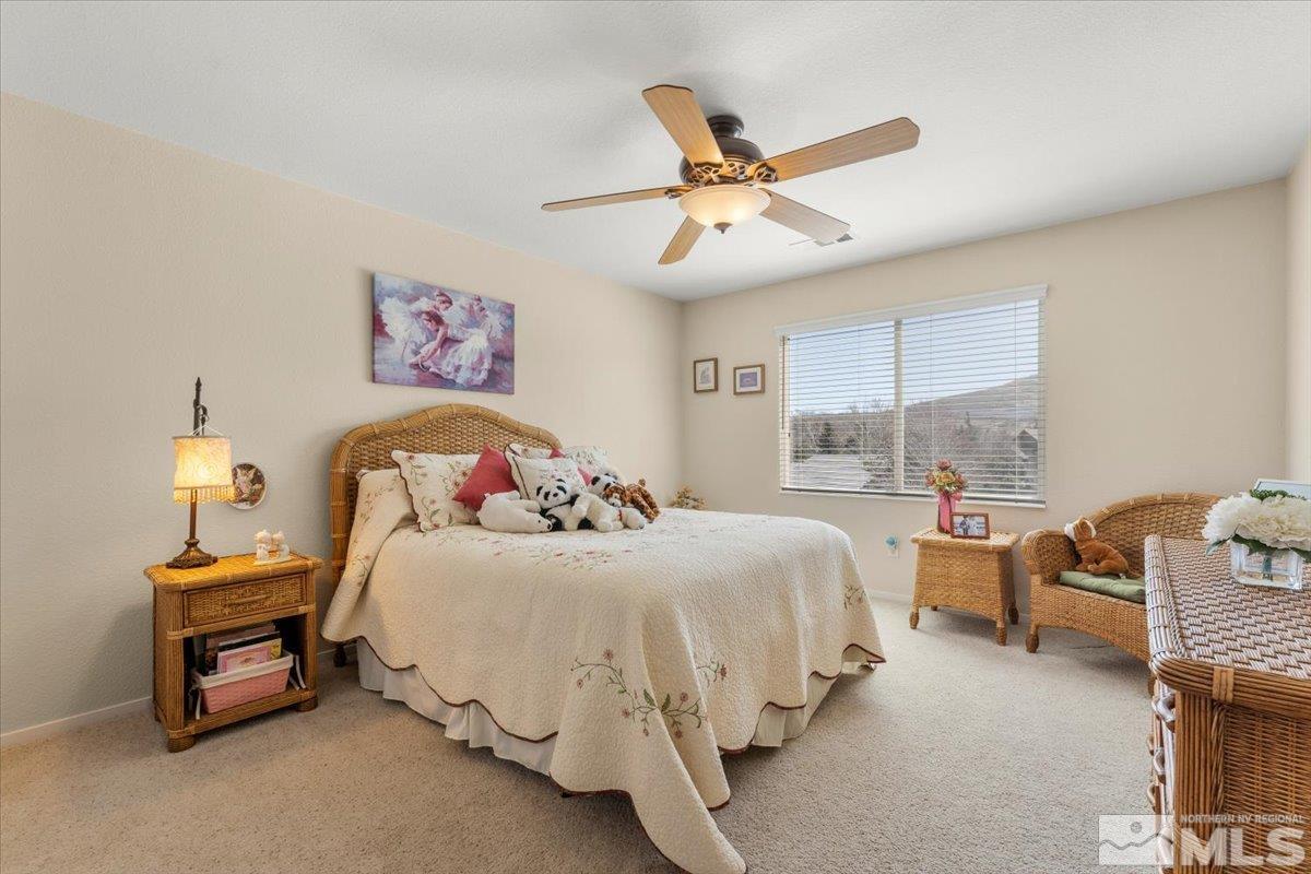 2225 Solitude Drive Reno, NV 89511 - Photo 17 of 40 a bedroom with bed and window
