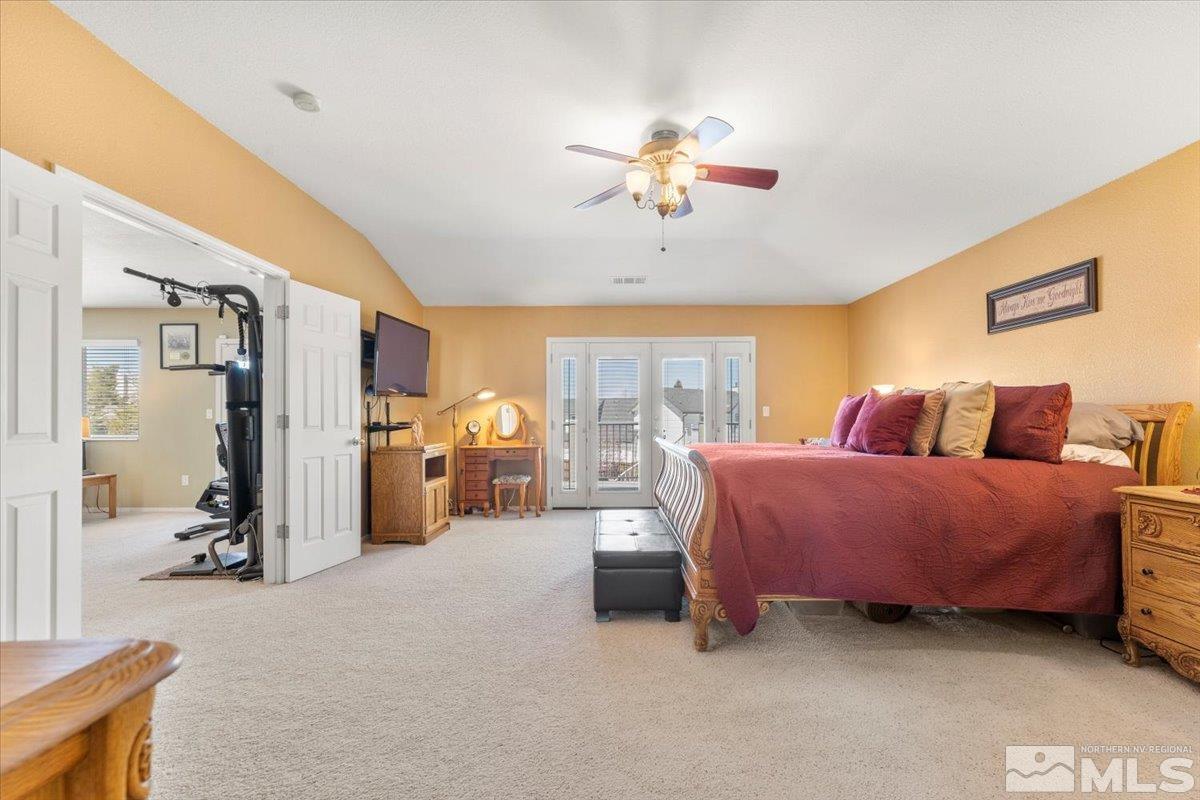 2225 Solitude Drive Reno, NV 89511 - Photo 20 of 40 a bed room with a bed and a chandelier