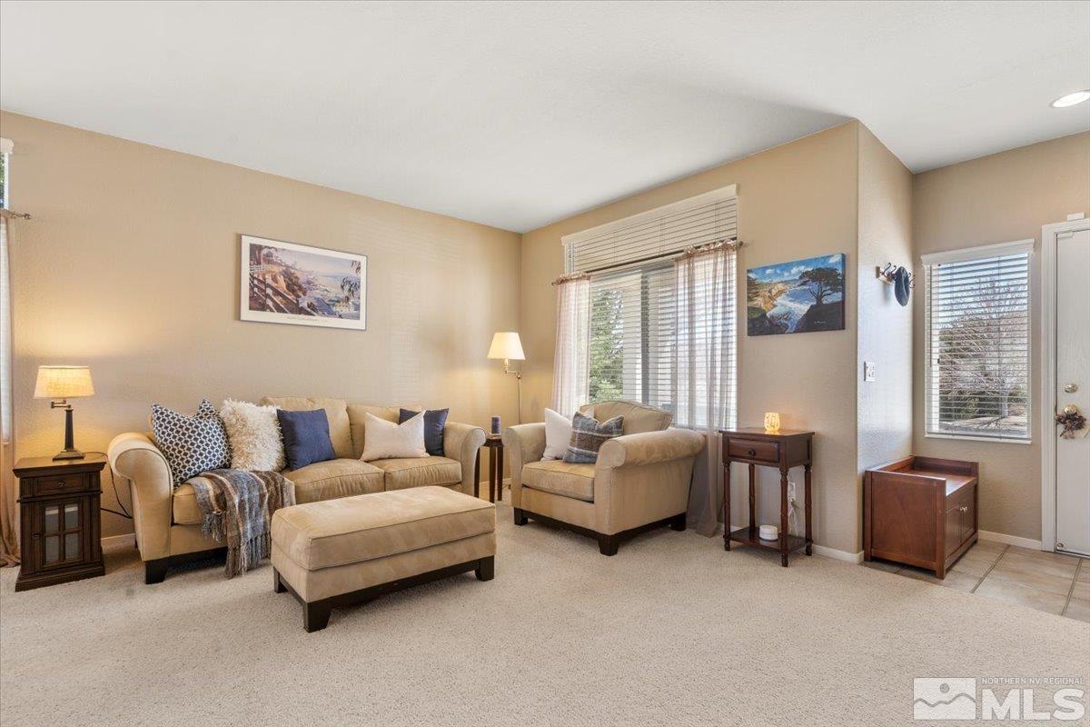 2225 Solitude Drive Reno, NV 89511 - Photo 3 of 40 a living room with furniture and large windows