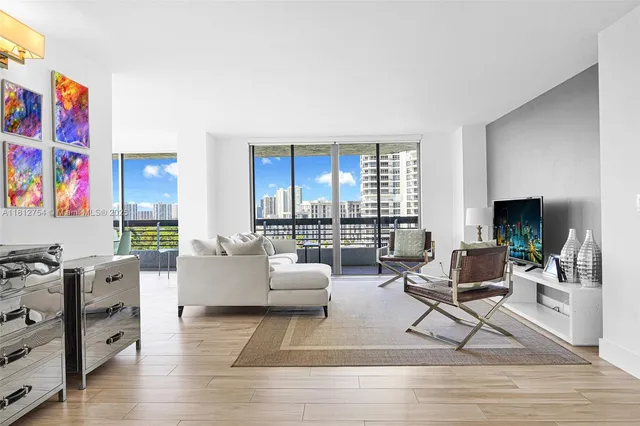 a large kitchen with kitchen island a large window and wooden cabinets