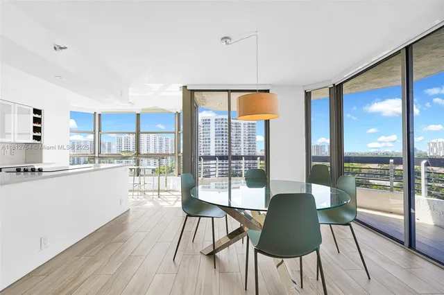 a kitchen with counter top space and wooden floor