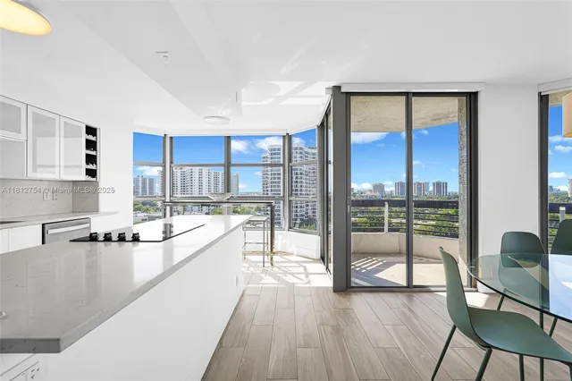 a kitchen with a sink cabinets and appliances