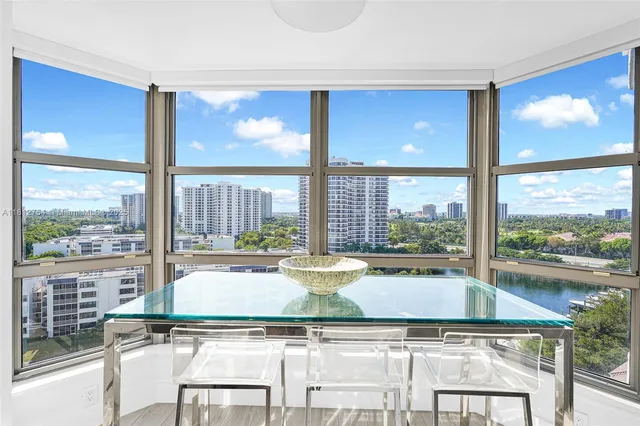 a bedroom with a large bed and a large window