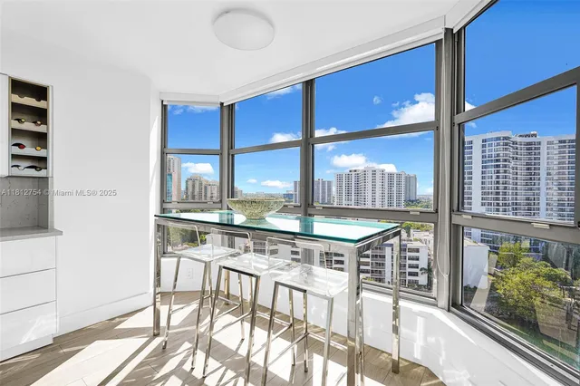 a spacious bedroom with a large bed and a large window