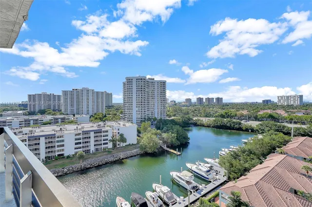 a bathroom with a shower a toilet and sink