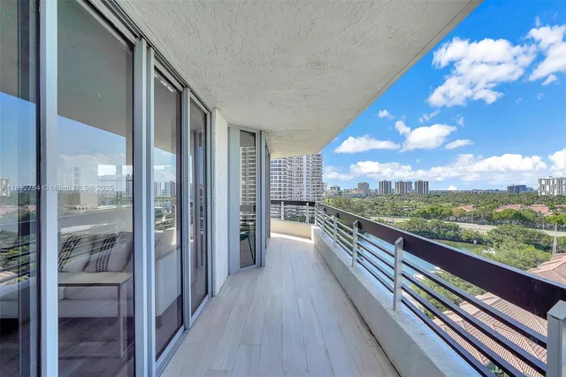 a hall with sink and mirror