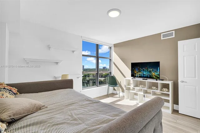 a view of a city with tall buildings