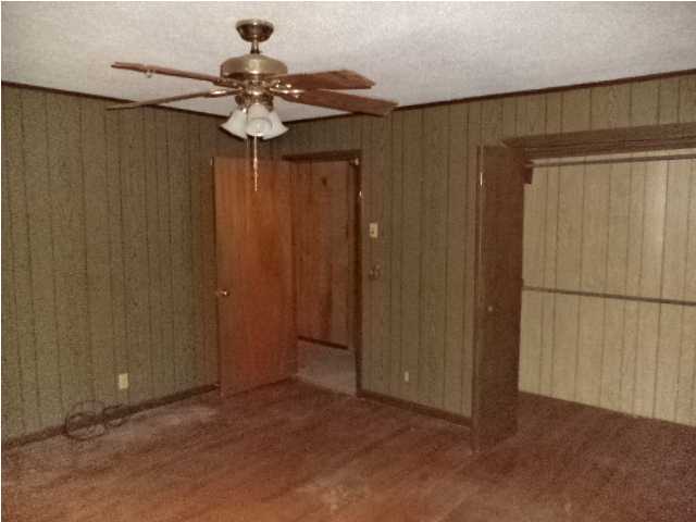 367 Cat Island Road DeFuniak Springs, FL 32433 - Photo 12 of 19 a view of a chandelier fan and closet in a room