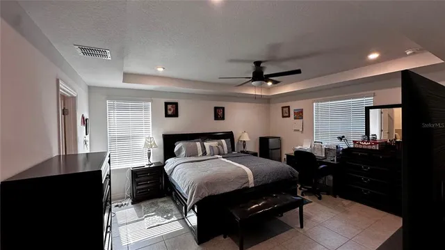 a bedroom with a bed and a closet