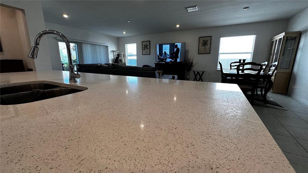 6623 Lullaby Way Mascotte, FL 34753 - Photo 5 of 24 a view of a living room and kitchen view