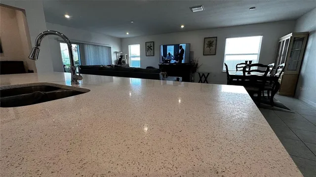 a view of a living room and kitchen view