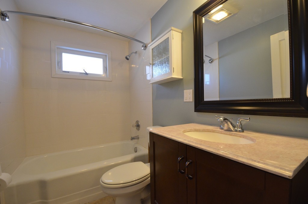 1239 Trapelo Road Waltham, MA 02451 - Photo 12 of 20 a bathroom with a sink a toilet and shower