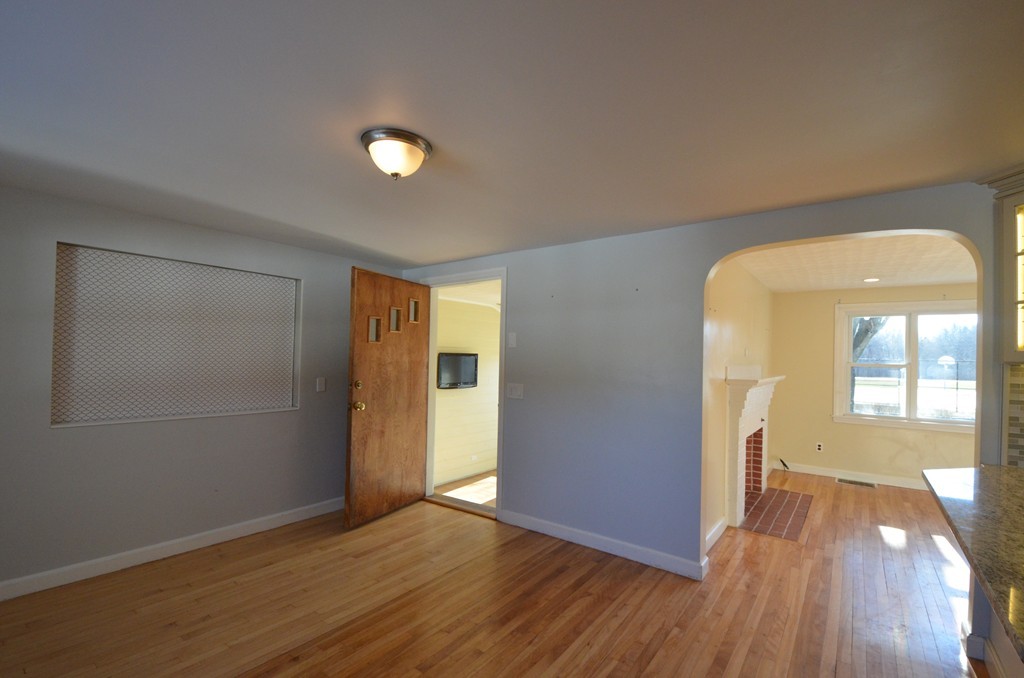 1239 Trapelo Road Waltham, MA 02451 - Photo 9 of 20 wooden floor in an empty room with a window