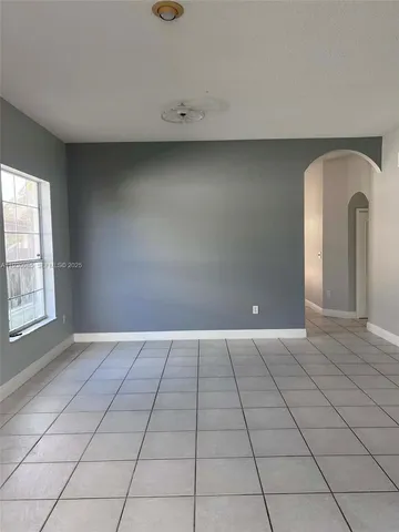 a kitchen with stainless steel appliances a refrigerator sink and microwave