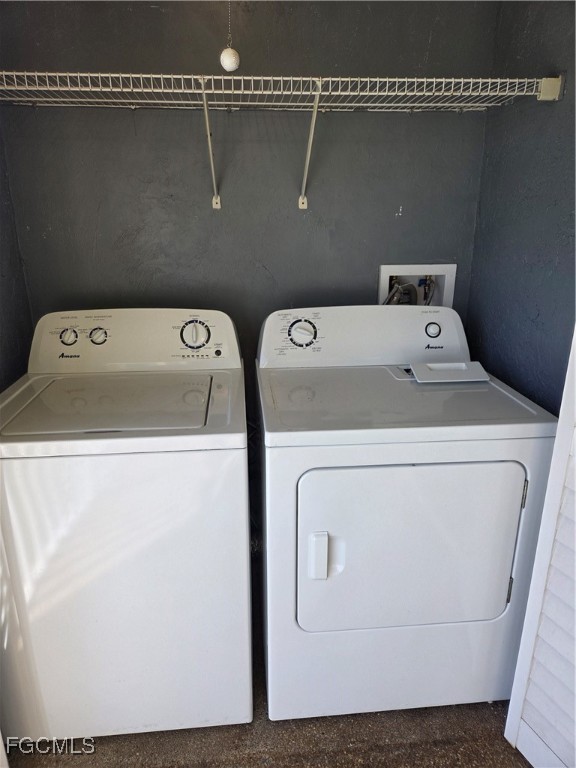 2780 Kings Lake Boulevard, Unit 203 Naples, FL 34112 - Photo 12 of 22 a utility room with dryer and washer