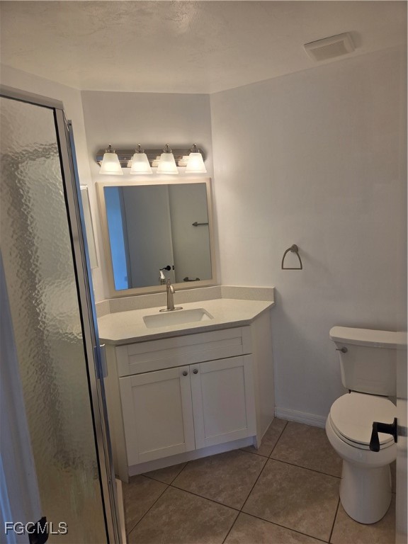 2780 Kings Lake Boulevard, Unit 203 Naples, FL 34112 - Photo 14 of 22 a bathroom with a sink toilet and mirror