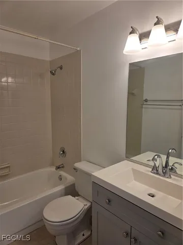 a view of a house with a big yard and large trees