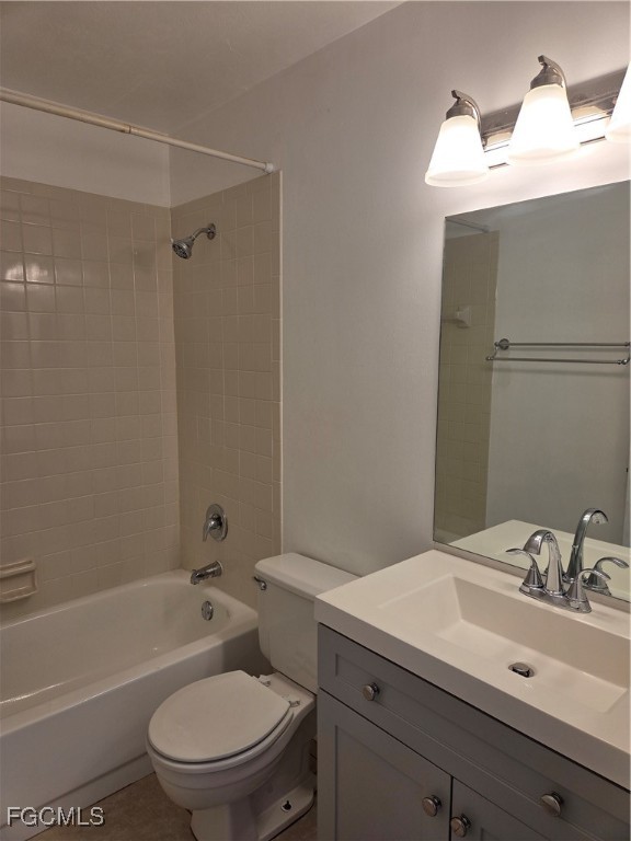 2780 Kings Lake Boulevard, Unit 203 Naples, FL 34112 - Photo 18 of 22 a bathroom with a sink toilet vanity and shower