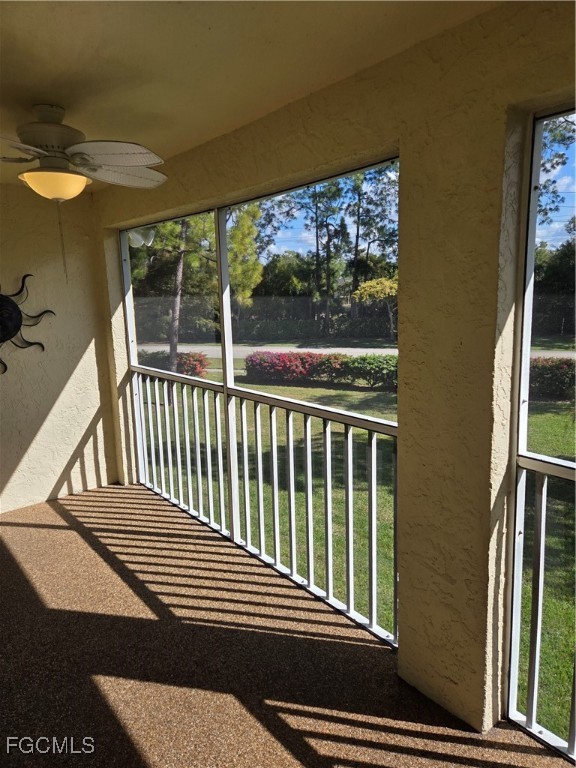 2780 Kings Lake Boulevard, Unit 203 Naples, FL 34112 - Photo 8 of 22 a view of balcony with wooden floor