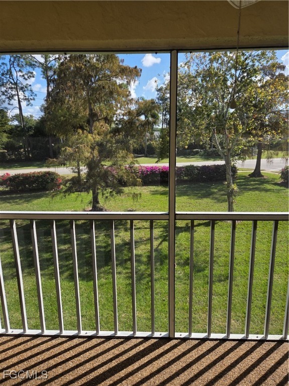 2780 Kings Lake Boulevard, Unit 203 Naples, FL 34112 - Photo 9 of 22 a view of a street from a balcony