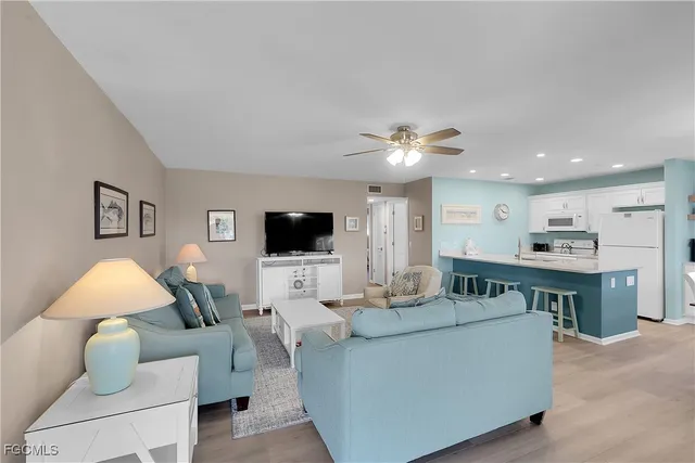 a large kitchen with a table and chairs