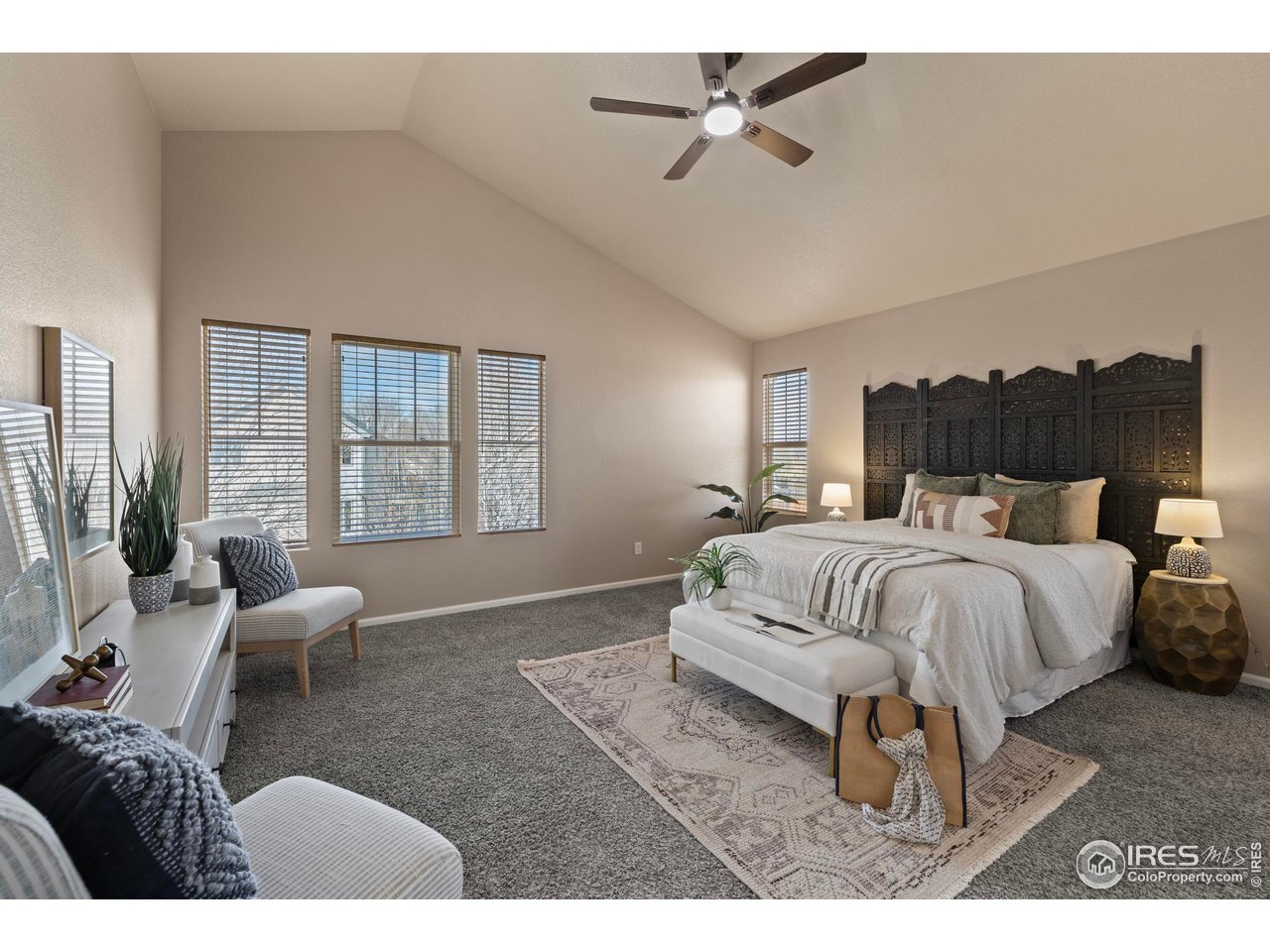 7399 Russell Circle Frederick, CO 80504 - Photo 13 of 35 a bed room with a bed and a couch