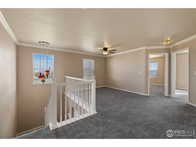 a view of a hallway view with staircase