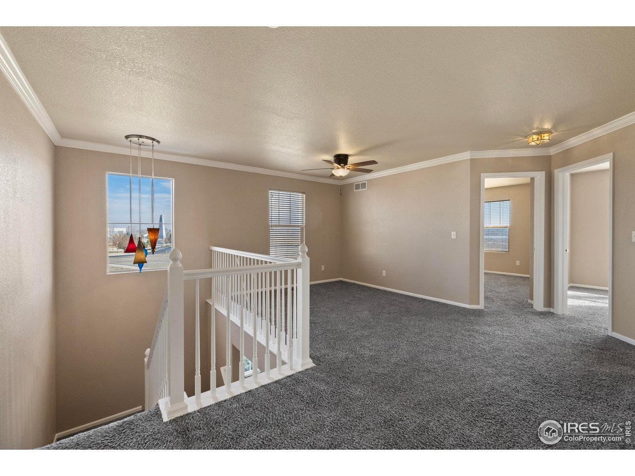 7399 Russell Circle Frederick, CO 80504 - Photo 19 of 35 a view of a hallway view with staircase