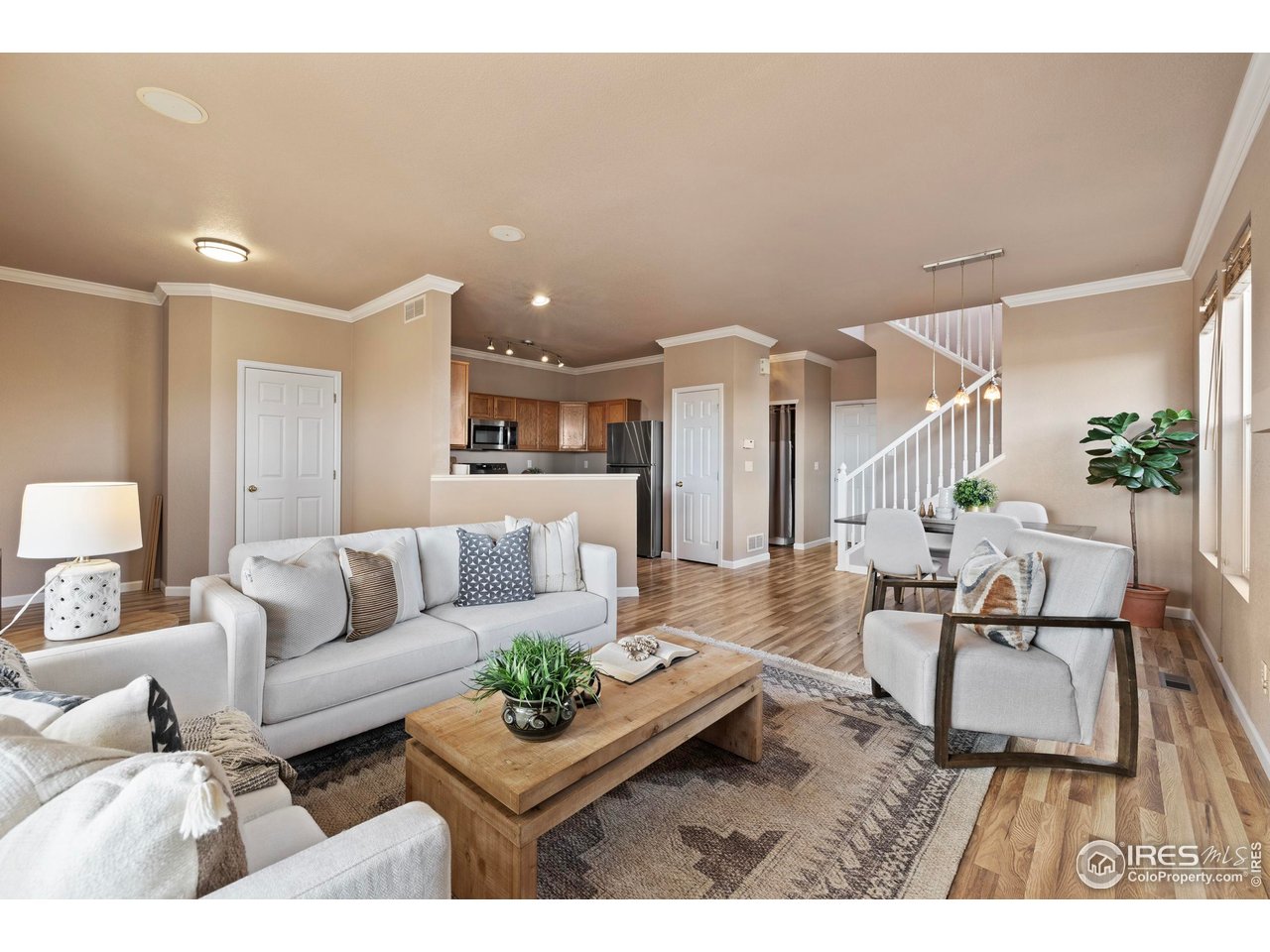 7399 Russell Circle Frederick, CO 80504 - Photo 4 of 35 a living room with furniture and wooden floor