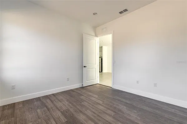 a kitchen with a sink a stove and cabinets