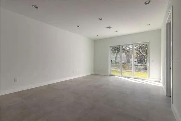 a kitchen with a refrigerator and cabinets