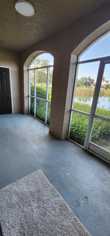 2015 Reston Road, Unit 2211 Orlando, FL 32837 - Photo 17 of 28 a view of an empty room with wooden floor and a window