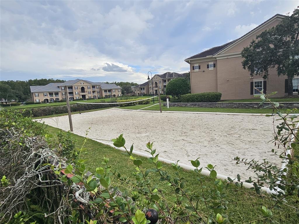 2015 Reston Road, Unit 2211 Orlando, FL 32837 - Photo 28 of 28 a view of a lake with a big yard and large trees