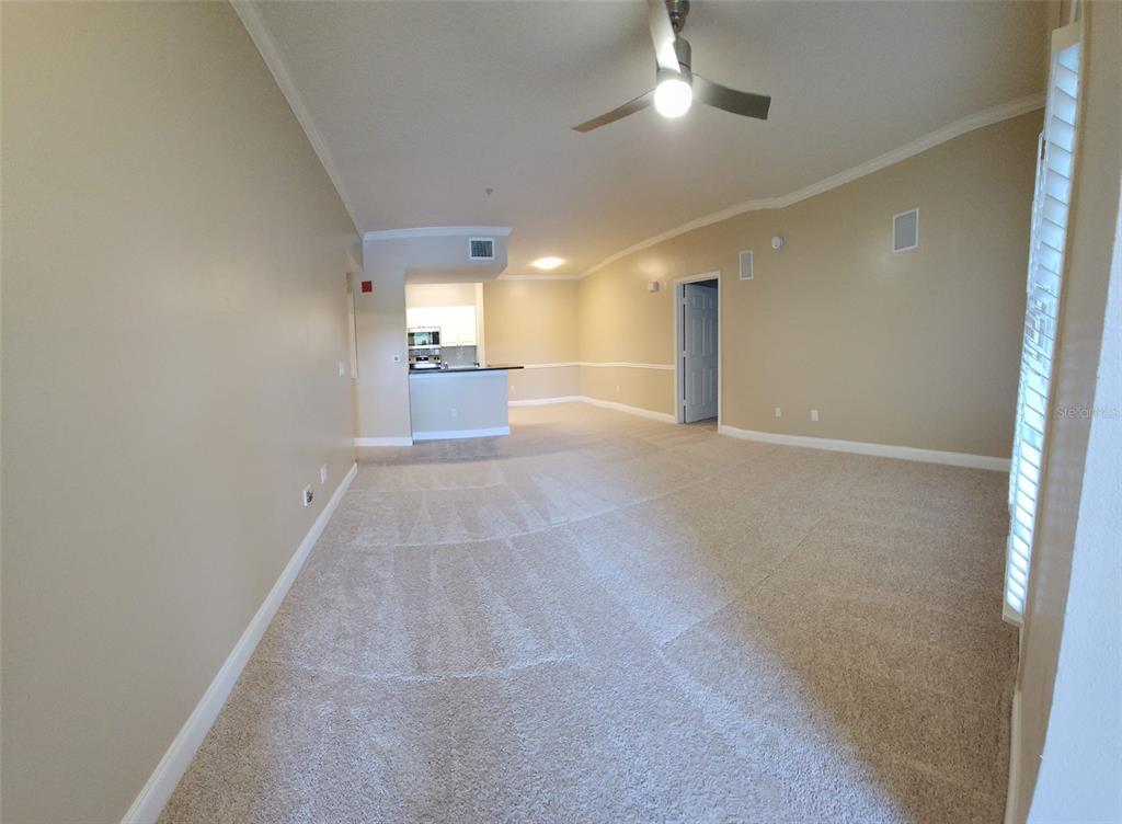 2015 Reston Road, Unit 2211 Orlando, FL 32837 - Photo 4 of 28 a view of a hallway with a chandelier
