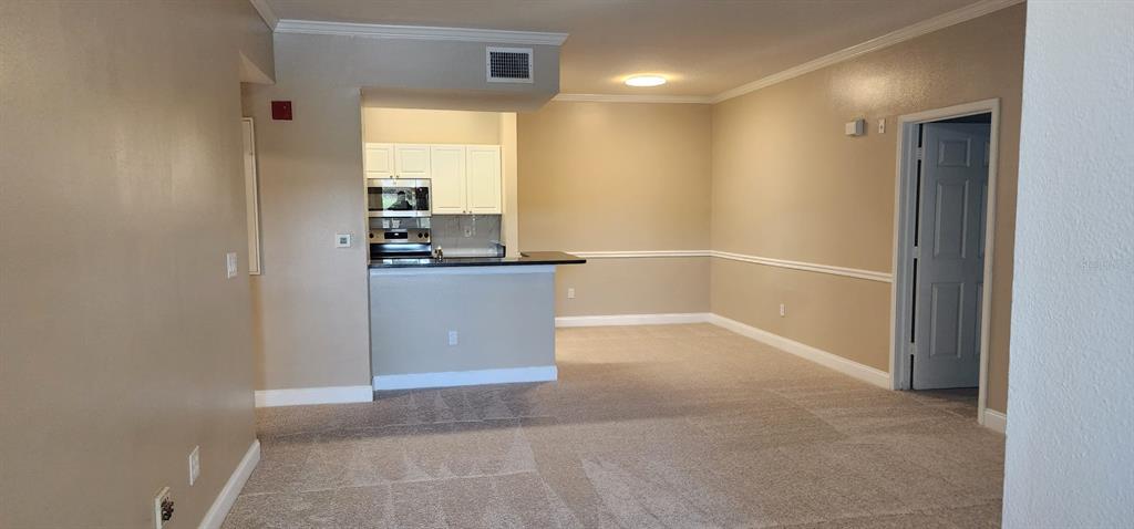 2015 Reston Road, Unit 2211 Orlando, FL 32837 - Photo 5 of 28 a view of a kitchen with a sink and cabinets
