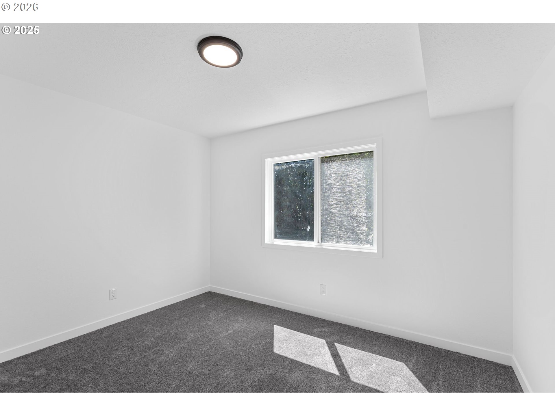 2 Falstaff Lake Oswego, OR 97035 - Photo 19 of 39 a view of an empty room with window and wooden floor