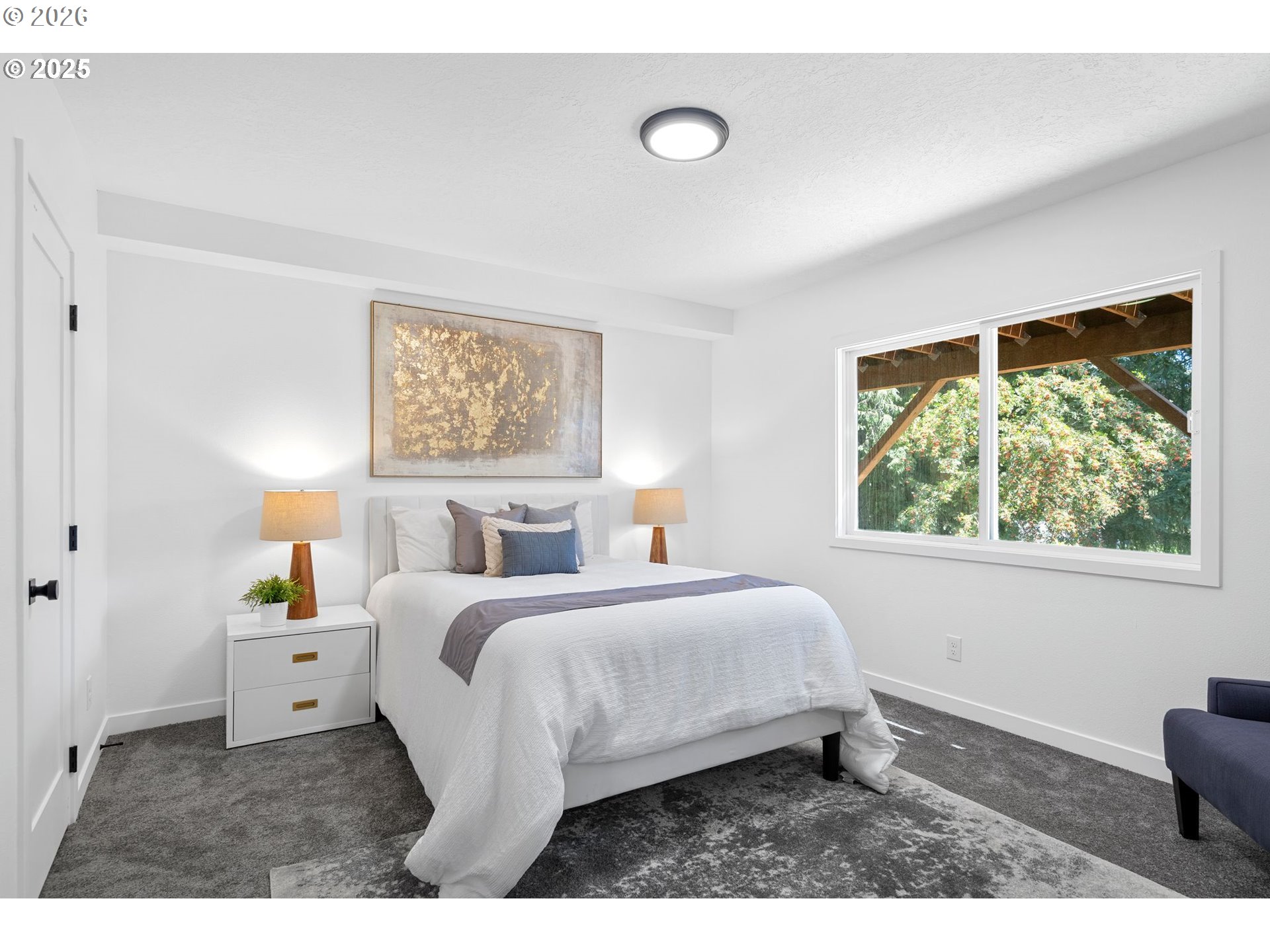2 Falstaff Lake Oswego, OR 97035 - Photo 23 of 39 a bedroom with a bed and a large window