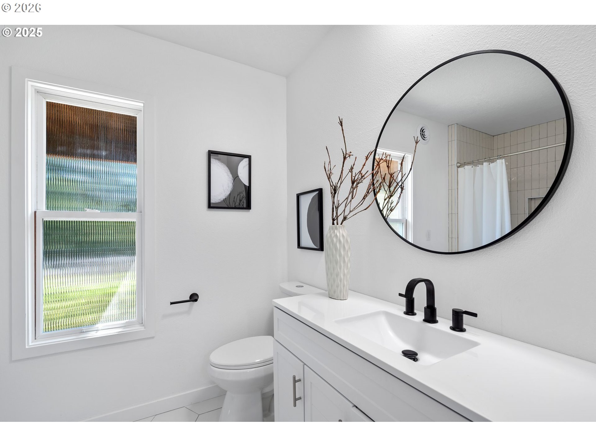 2 Falstaff Lake Oswego, OR 97035 - Photo 24 of 39 a bathroom with a toilet a sink a mirror and a window