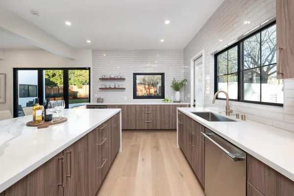 a kitchen with a sink and large window